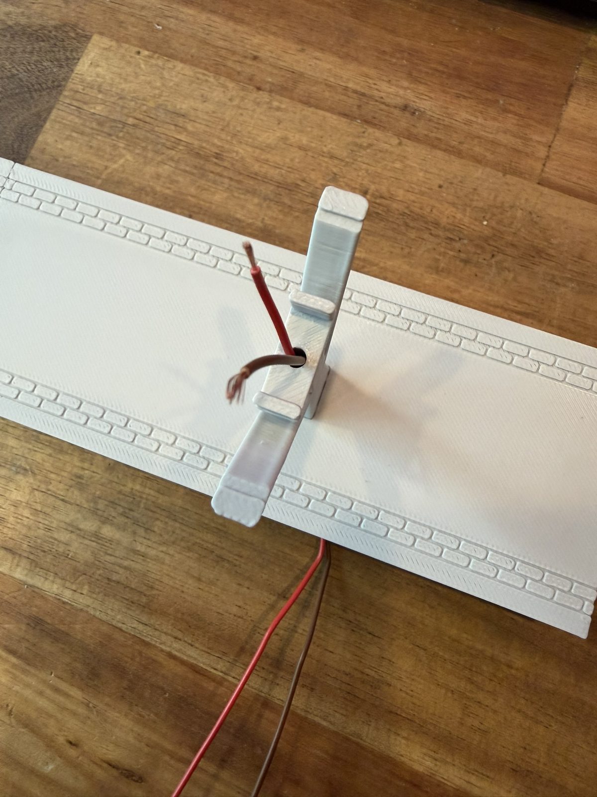 Real print: the Viessmann 5050 light strip with its wiring laid on a platform deck
